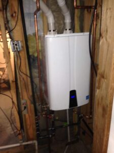 Tankless water heater in utility room